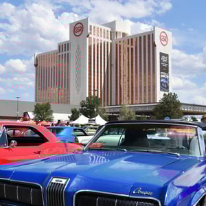 Photo of Grand Sierra Resort in Reno, NV with classic cars in foreground.